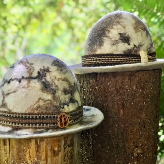 Wet felted hat with handwoven band made of handspun yarn. Hat and bands feature all natural colors of the sheep and alpaca fleeces. Black walnut and sea shell buttons.  thumbnail