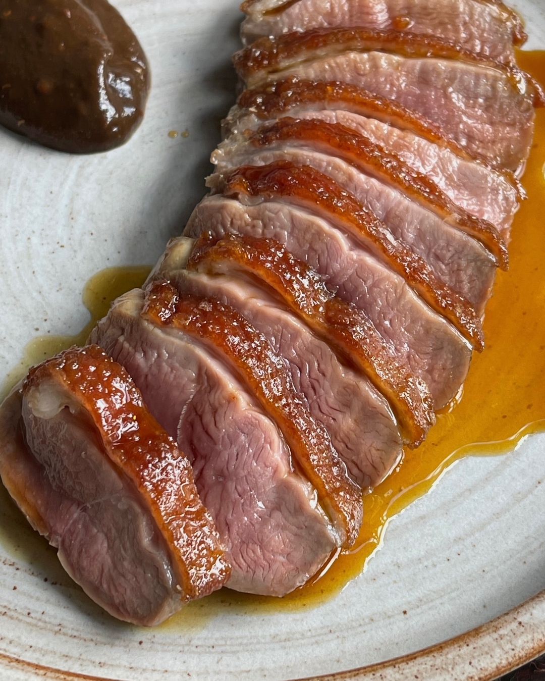 Precisely cooked duck breast with a rich, black garlic and roasted pear sauce. Deep with umami, its an ideal main for co