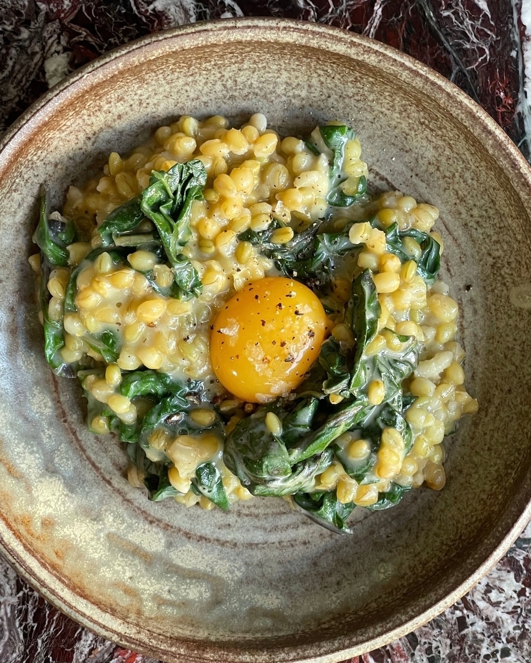 An off-menu special for the veggos. 
Toasted farro with an earthy celeriac cream and egg yolk. Stir it all in for the ul