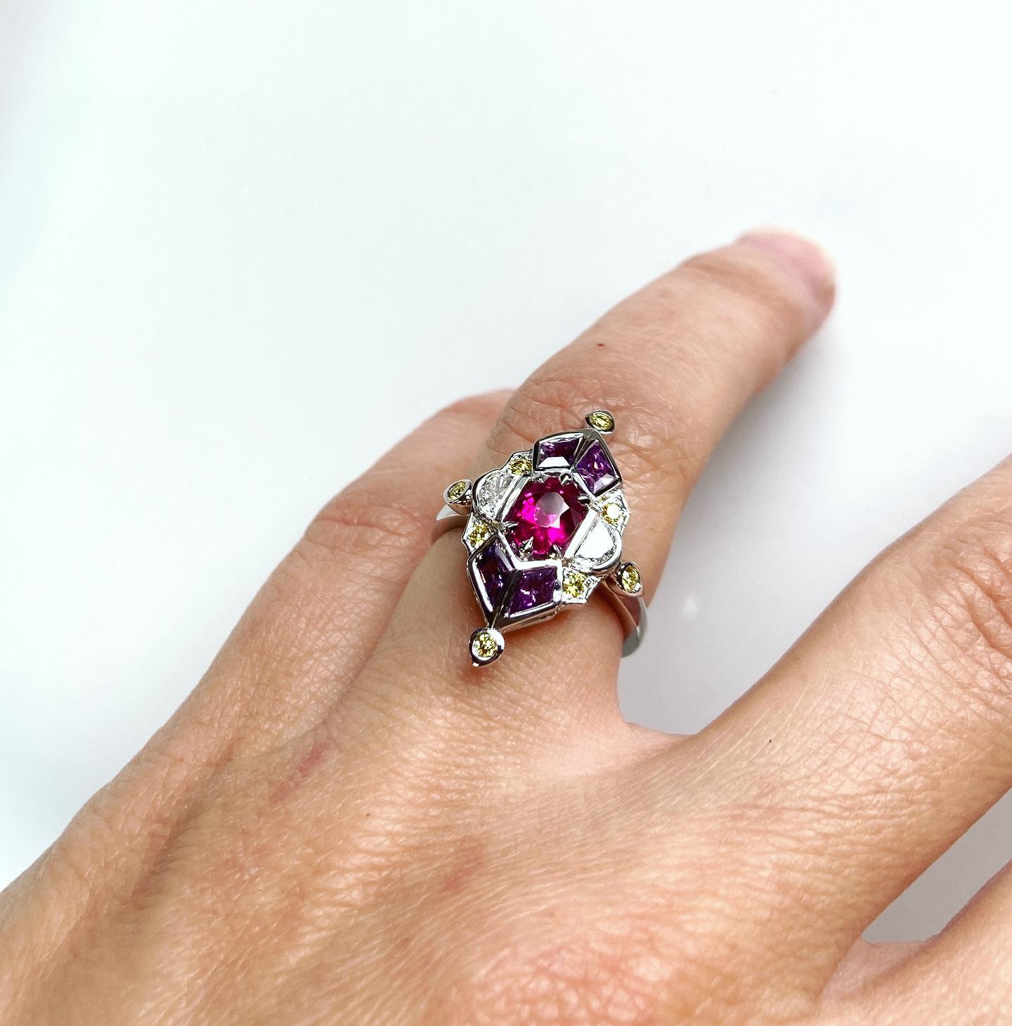 Custom design engagement ring 🖋 
Hand made 👩🏻‍🏭
White gold, Ruby, sapphires, white and yellow diamonds 🌙🌗✨