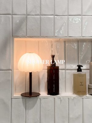 She’s stunning ✨ #bathroomorganization #bathroomdecor #showerlamp #chic #luxurybathroom 