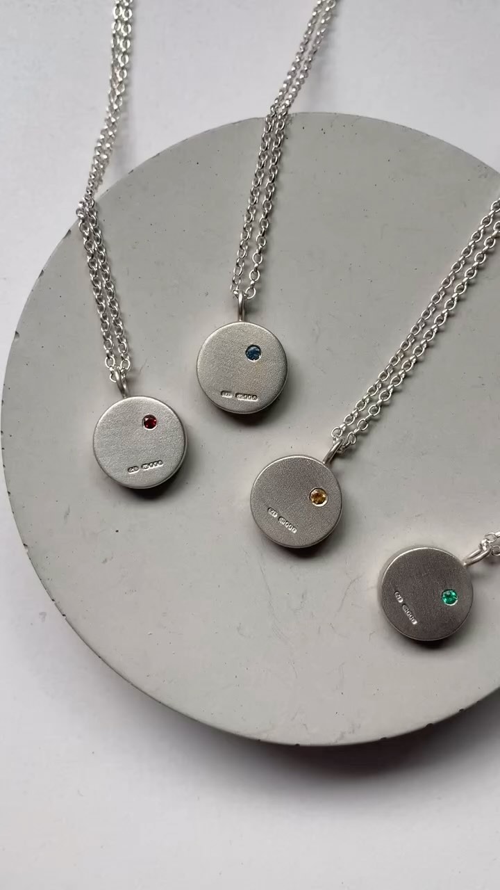 A set of Chub Disc necklaces all set with different stones 💎