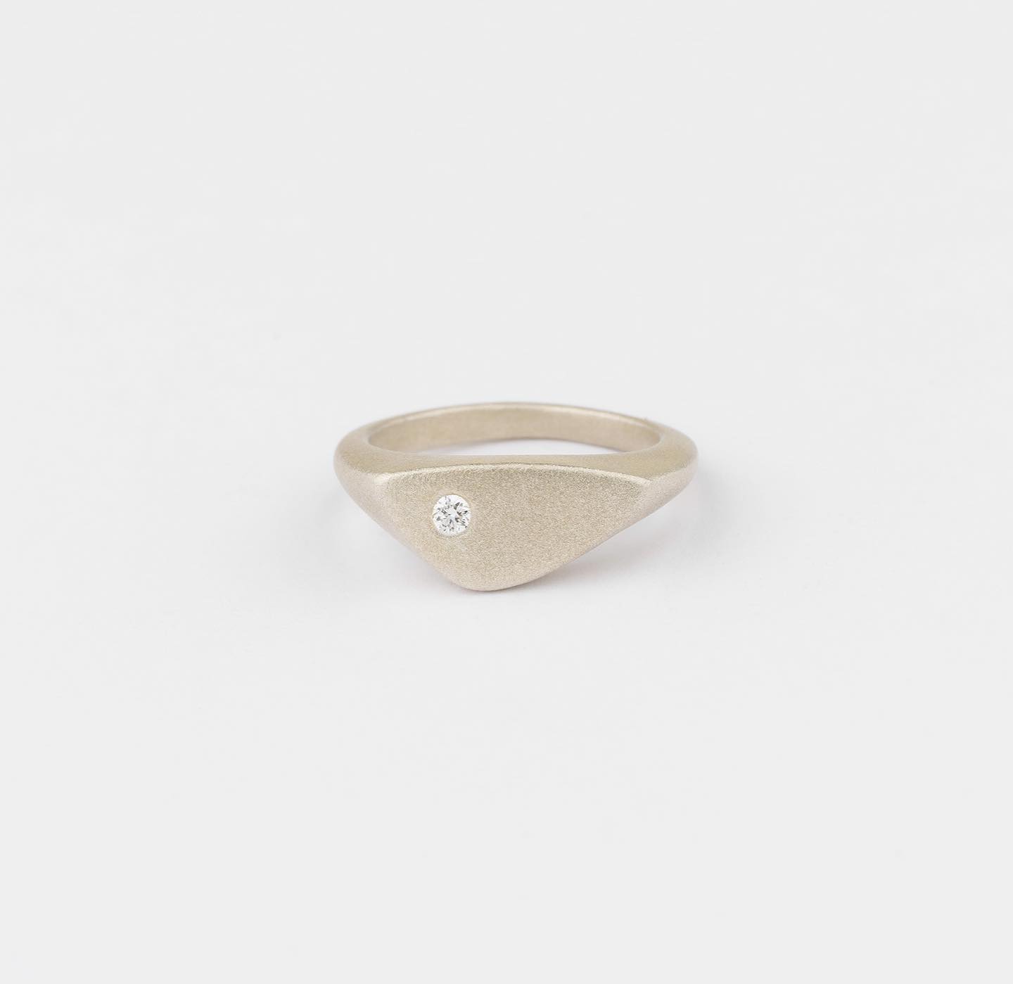 Pop Signet Ring with a Canadamark diamond and a frosted finish ❄️ This style is now available in larger sizes online - a