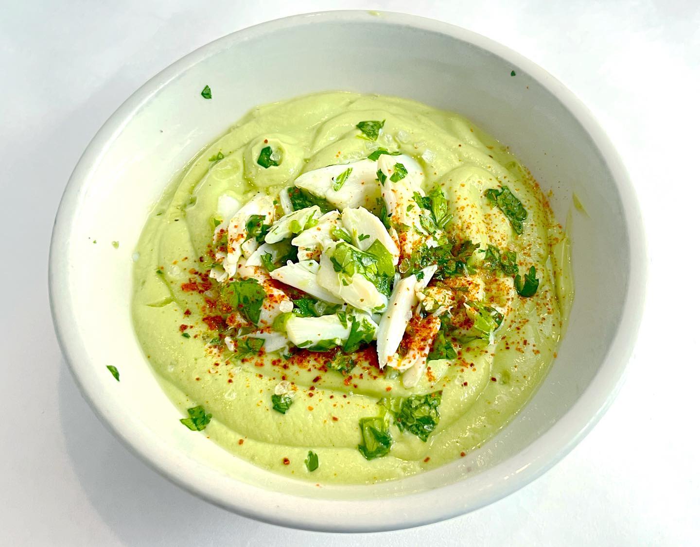 Alligator Pear Gaspacho 🐊 featuring fresh Louisiana jumbo lump crab and locally-grown avocados 🥑 served icy cold ❄️ 🥶 
.