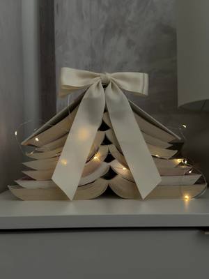 A little holiday magic made from my favorite reads and a strand of fairy lights. 📖✨🌲 #homewithyoshi #christmasdecor #boo