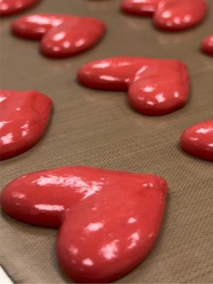Strait from out kitchen: Red Raspberry Marmalade macarons. Our first-time-ever heart shaped creation ♥️ Here’s a peek of