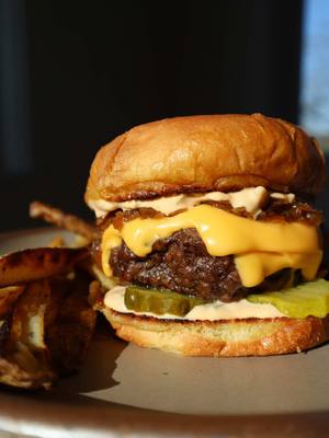 Classic Grilled Cheeseburger with Caramelized Onions, Homemade Burger Sauce, Bread & Butter Pickles, and American Cheese