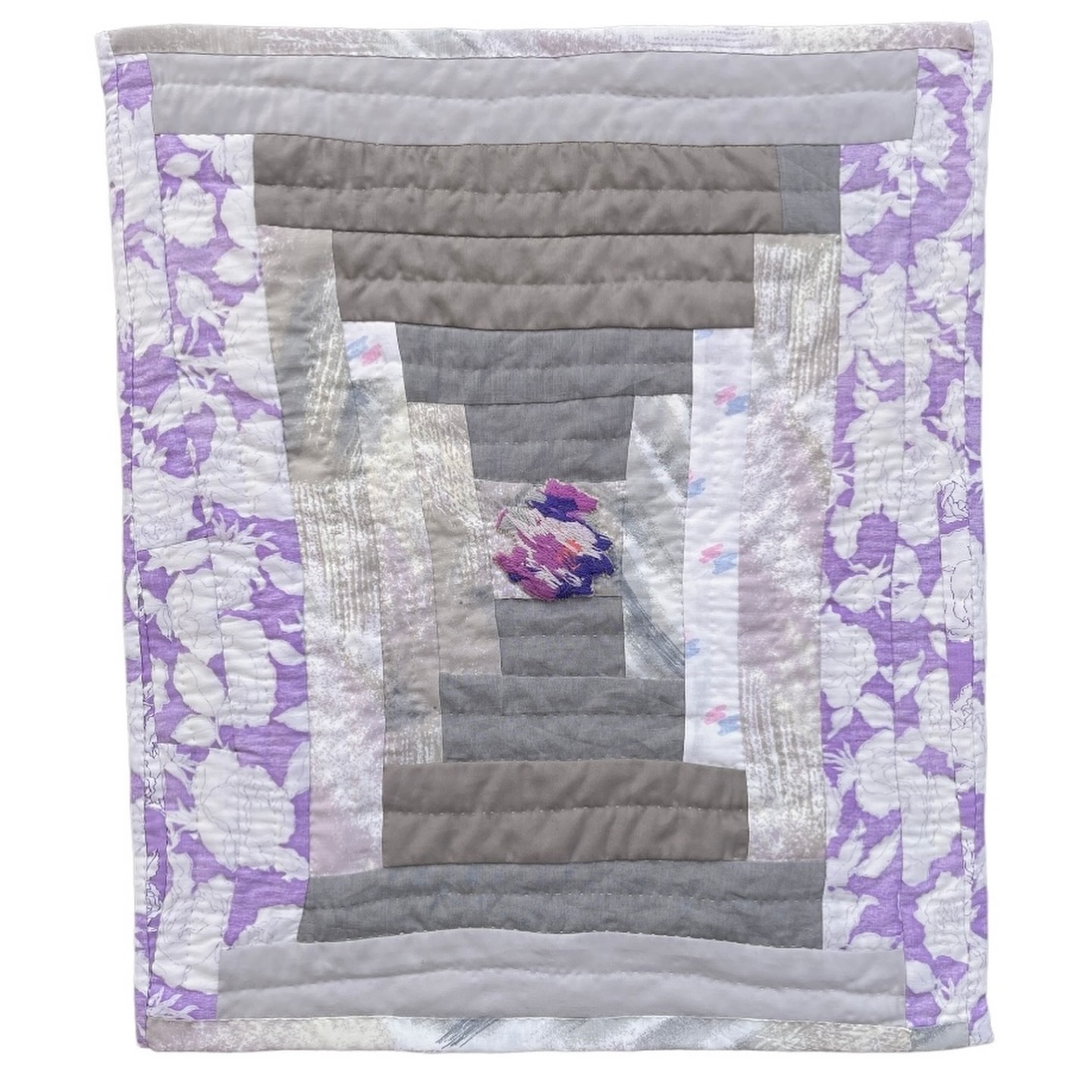 A new quilt! This one is made up of some favorite secondhand fabrics from my stash. See the fun embroidered patch in the